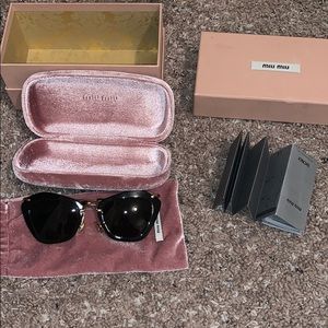 Miu Miu Black sunglasses.